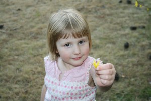 Tiller shows off a dandelion.