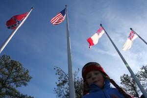 Tiller at the Bottom I took some shots of Tills with the flags at the bottom, while we waited for the boys. Did I mention the Mountain Goat and her Mama beat them down the mountain? By many minutes? Girls rule, boys drool. (Tiller and I decided we wouldn't tell the boys that, though.)