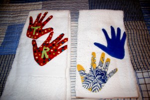AngelArts Handtowels My friend Adrienne makes some beautiful handsewn gifts, and she made these for me. She traced Rollie and Tiller's handprints and put them on handtowels. I gave a set to each of the grandmothers and kept this set for myself. So sweet!