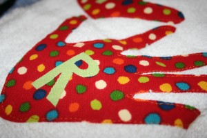 Closeup of R on Handtowel On this one, their hands were so close in size that she put letters on them to designate whose hand is whose.