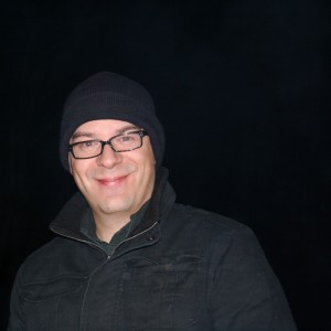 And Ned, back in black, tending the fire. 