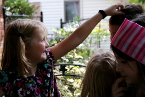 Not a great photo, but a rare moment where the kiddos are lovingly touching one another. Had to be captured.