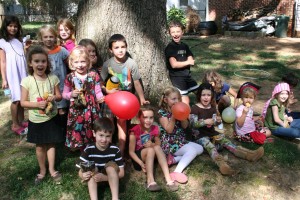 Treasure Hunters in a group by the tree. Surprisingly, the biggest hit from the pirate treasure? Balloons. 