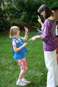 Tiller doing the little gang sign and handshake. Then she got a little diploma. She is a cutie patootie.