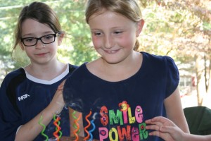 Chloe and Tiller, about to blow candles out. 