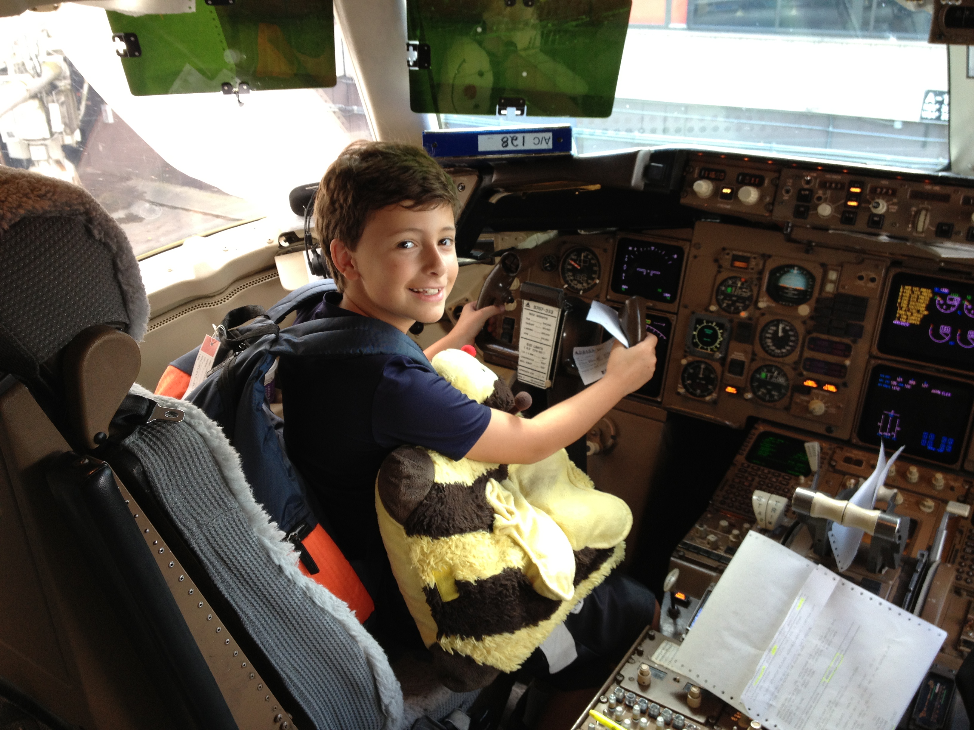 The pilots were super cool to let R. sit in the cockpit. Nothing says professional pilot like a bumble bee pillow pet in the cockpit.